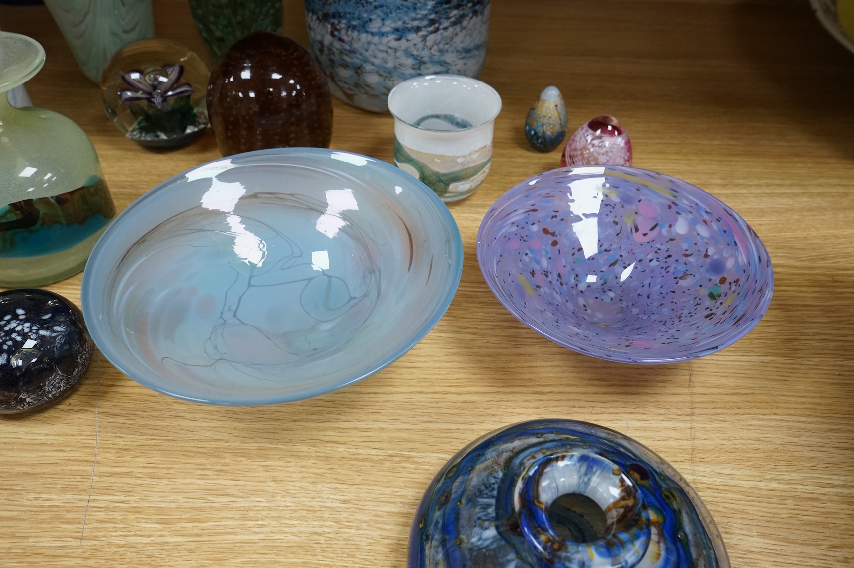 A collection of mixed art glass and paperweights, including two Mdina flared rimmed glass vases, Adrian Shankey glass, an Isle of Wight squat vase, various paperweights and a dump etc. (15)